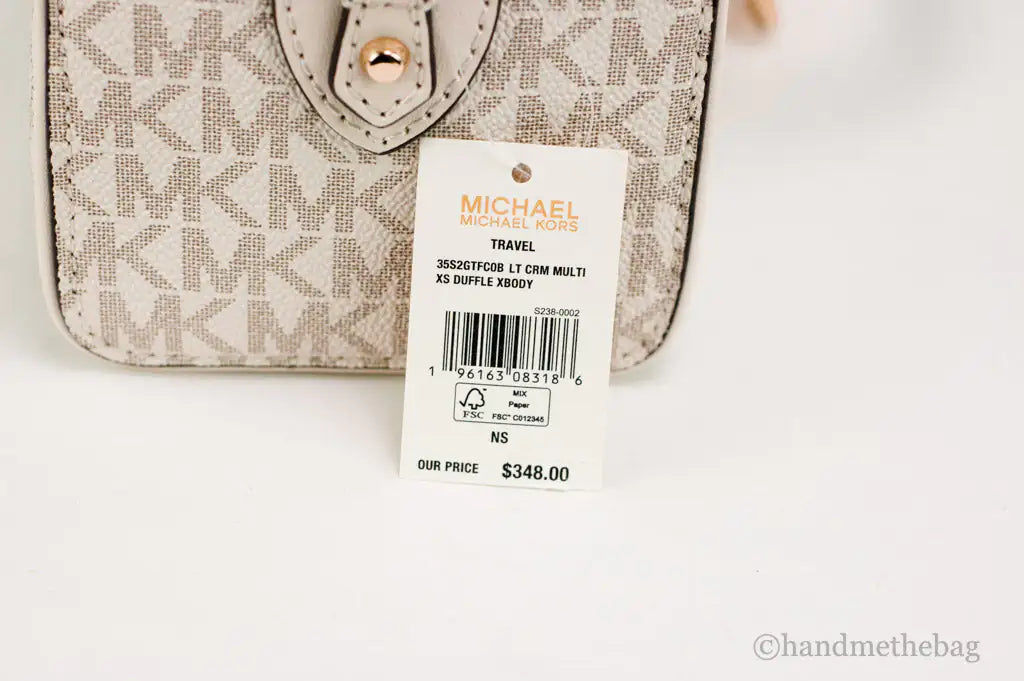 Michael Kors Travel XS Light Cream Signature PVC Duffle Crossbody Handbag